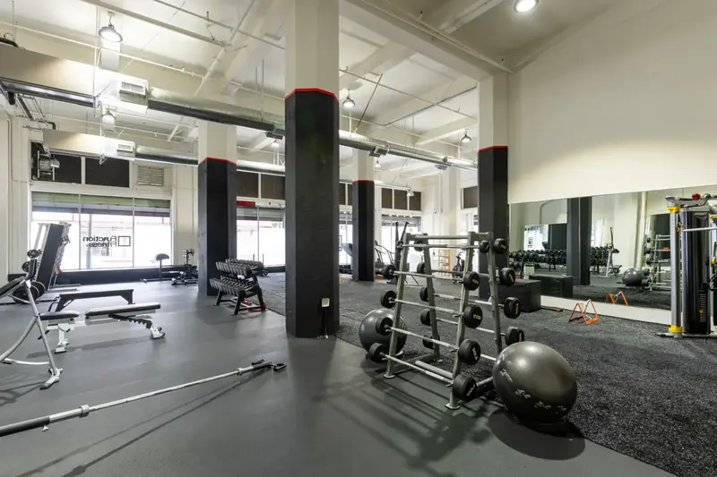 Senior coach leading a one-on-one personal training session at Function Fitness DTLA
